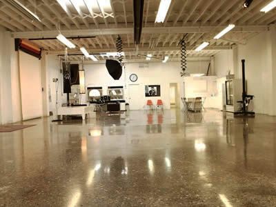 A large empty room with a shiny concrete floor