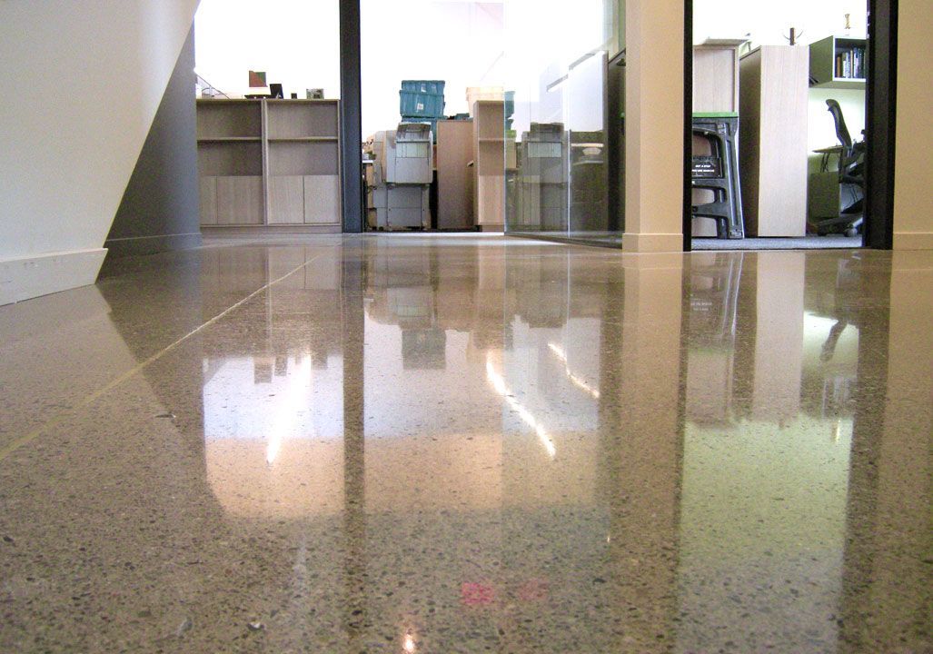 A room with a shiny floor and a doorway