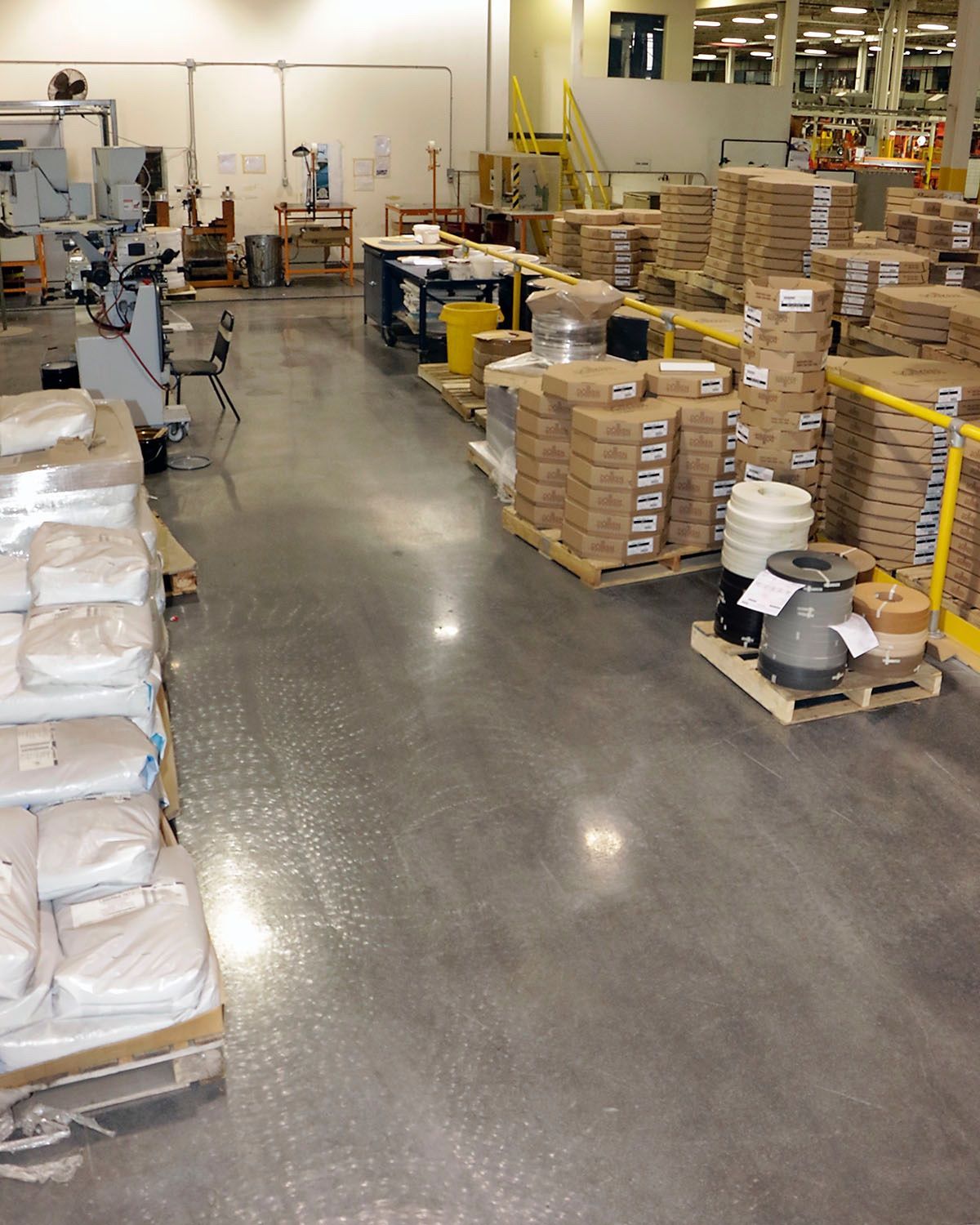 A large warehouse filled with lots of boxes and pallets