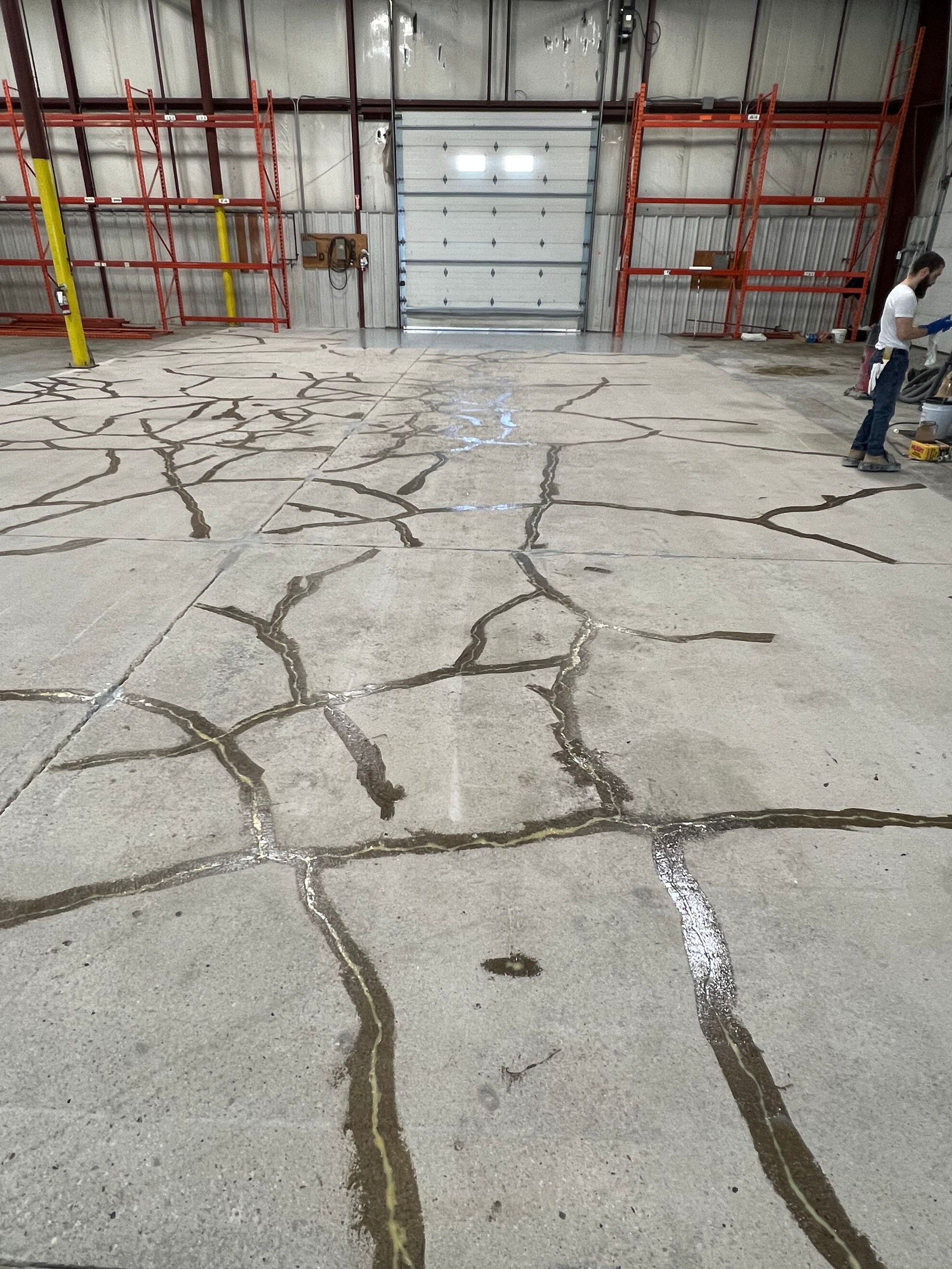A warehouse with a lot of cracks in the floor
