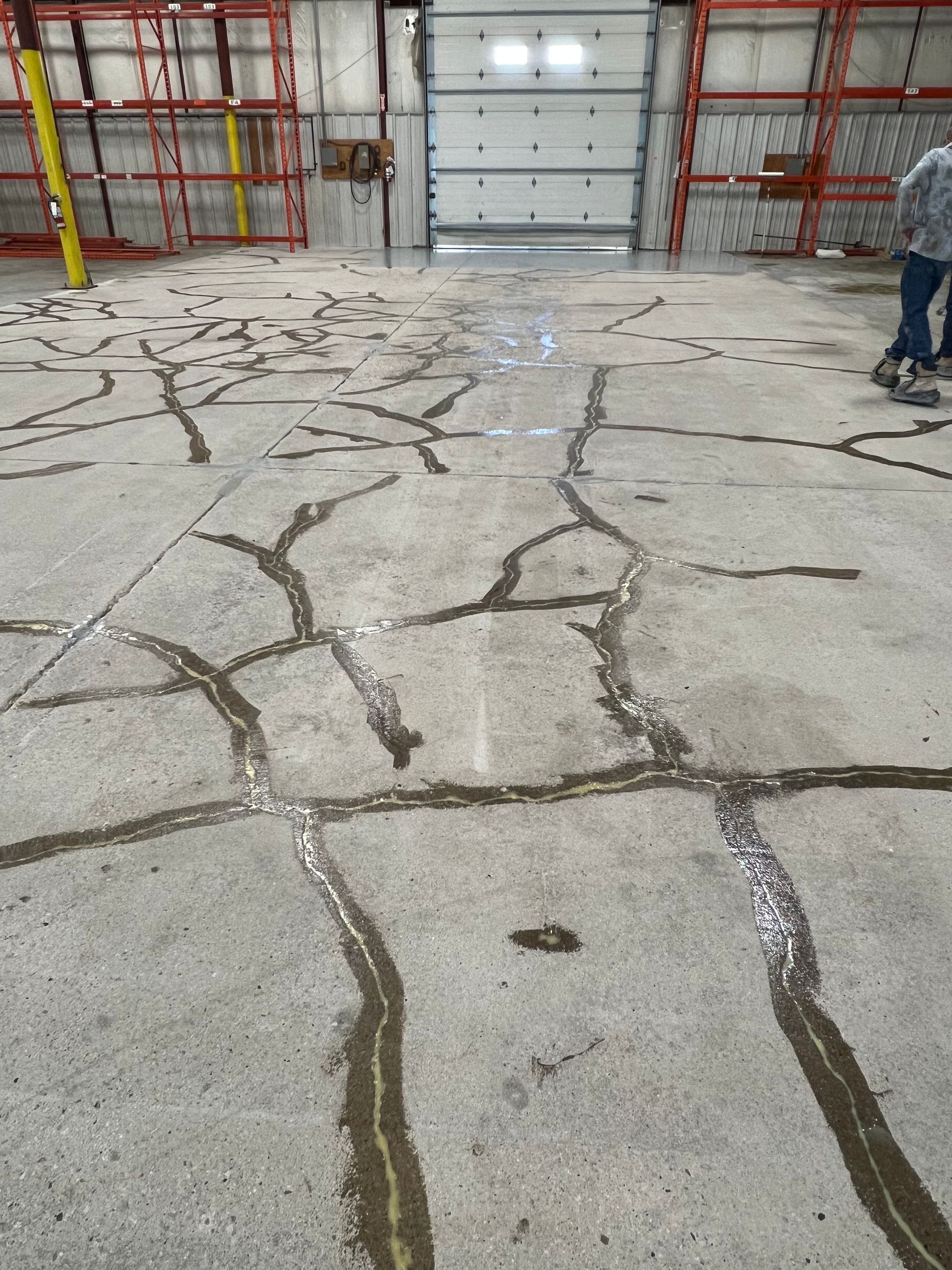 A concrete floor with a lot of cracks in it