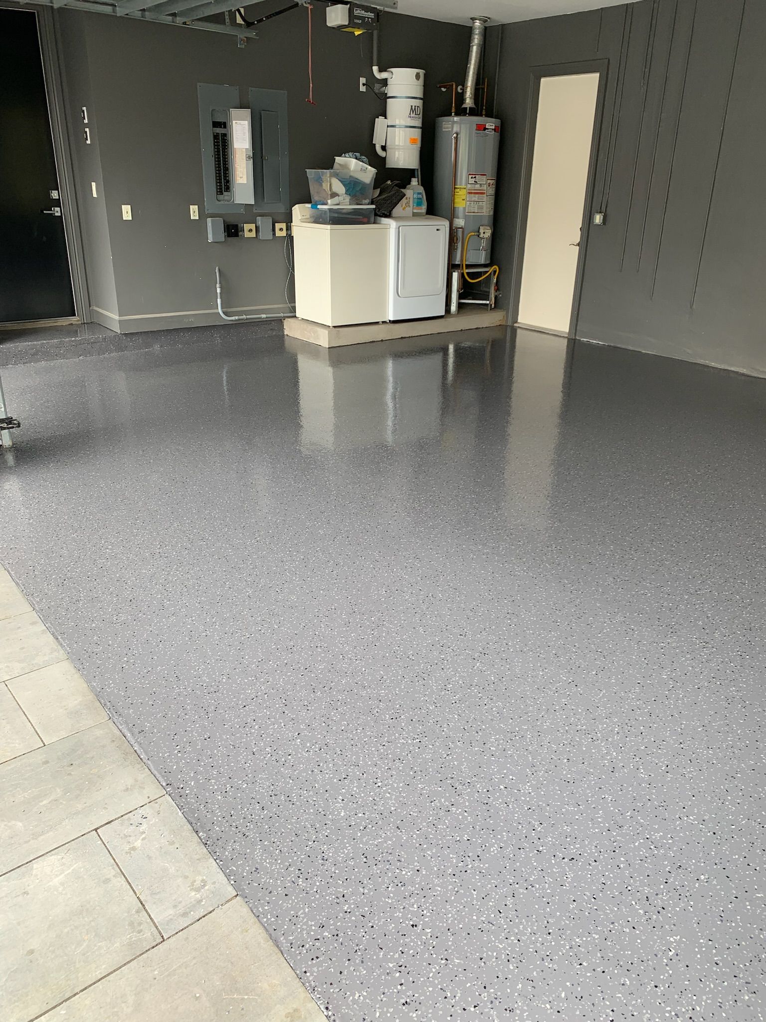 There is a laundry room in the garage with a washer and dryer.