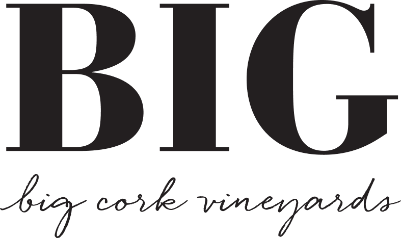 A black and white logo for big cork vineyards.