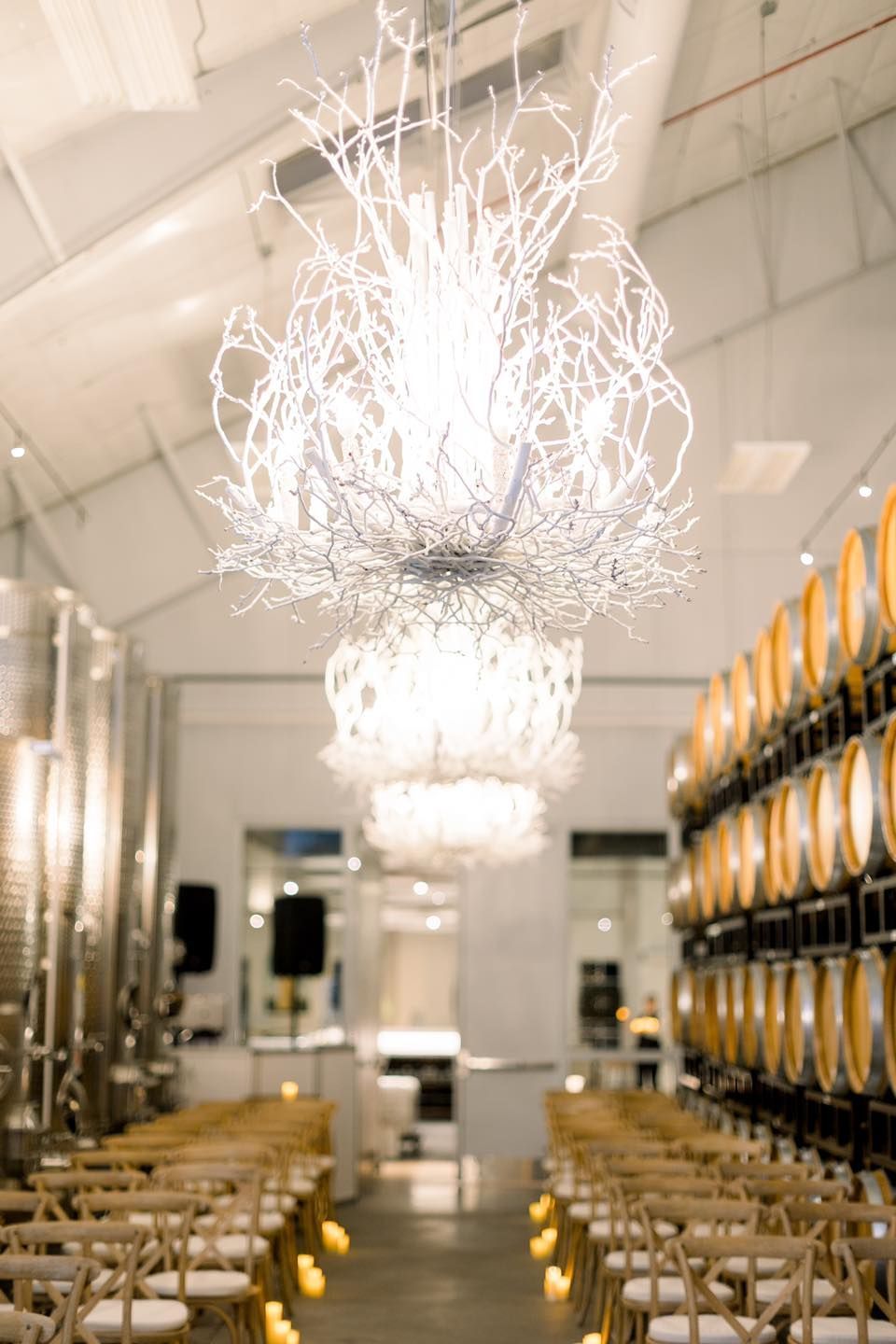 There is a large chandelier hanging from the ceiling in the middle of the room.