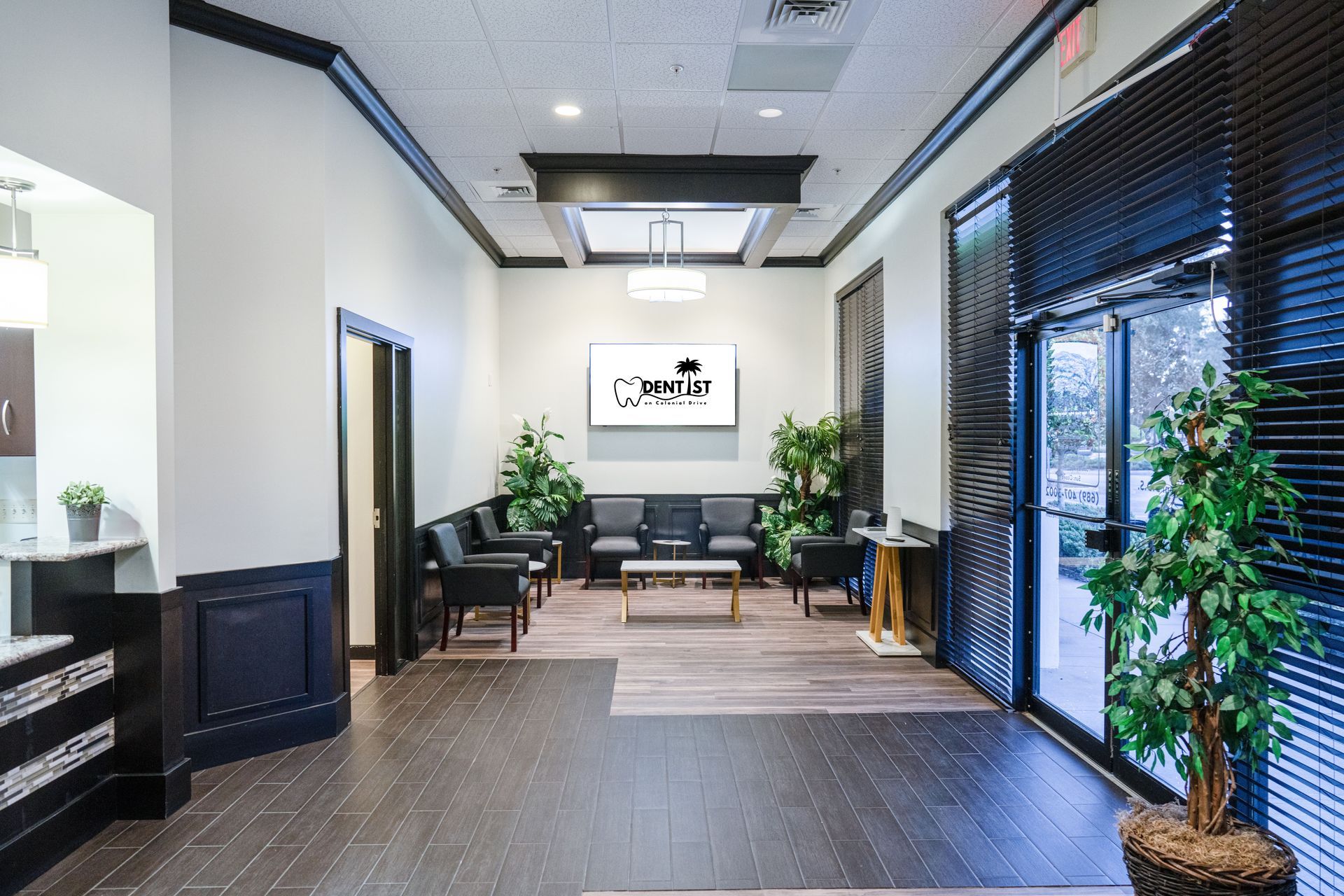 A man is smiling while sitting in a dental chair.