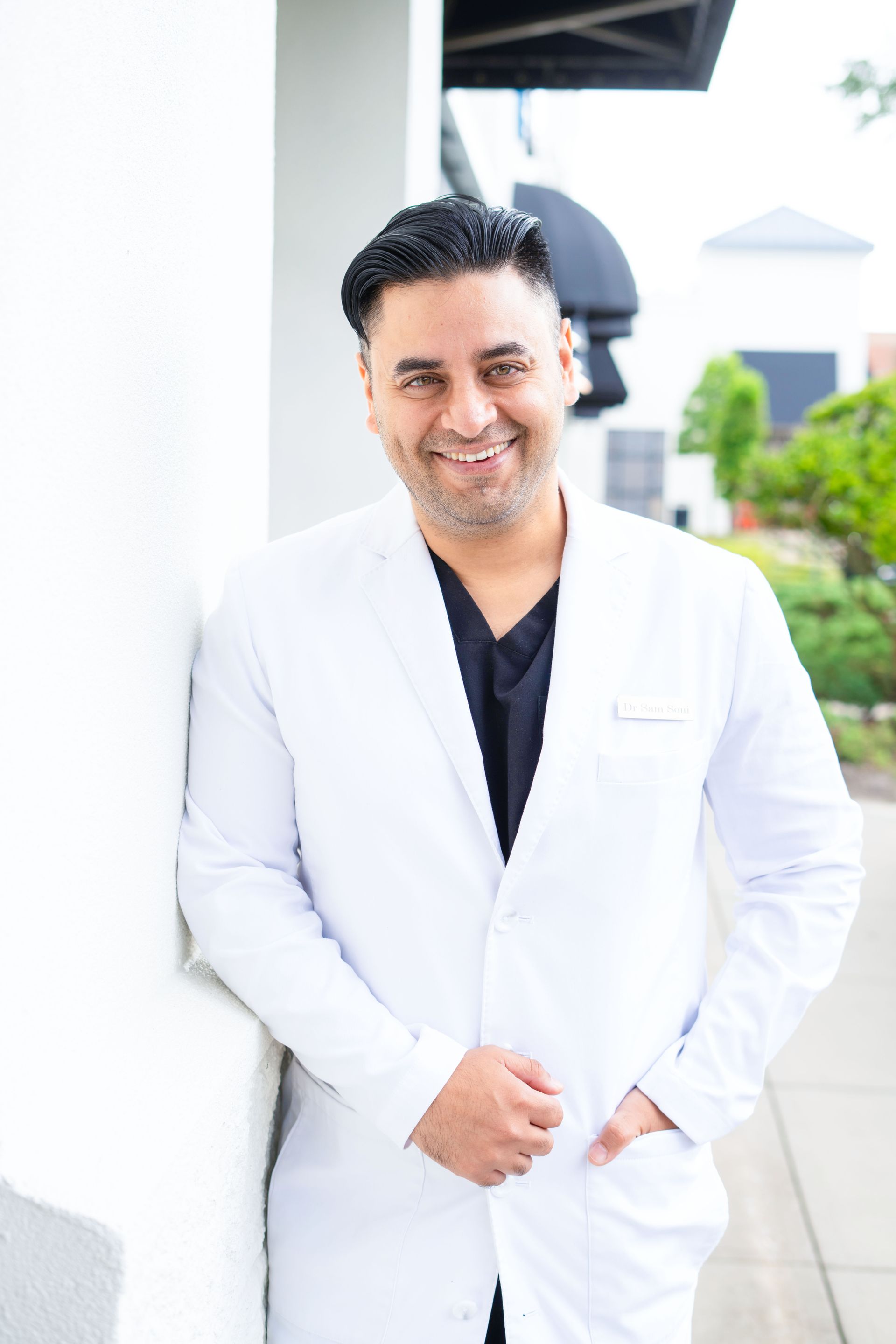 A woman is sitting in a dental chair talking to a dentist.