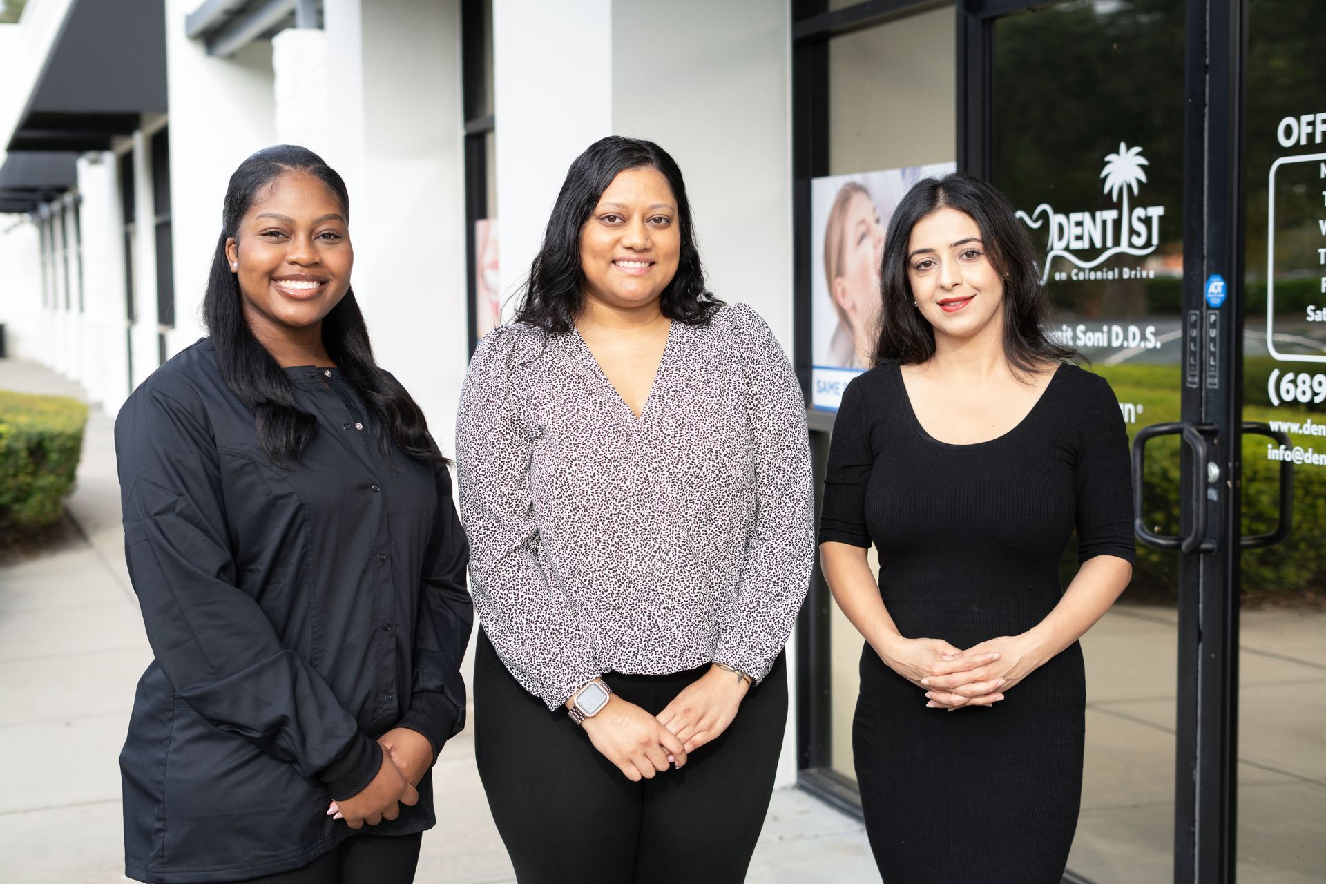 A woman is examining a man 's teeth in a dental office.