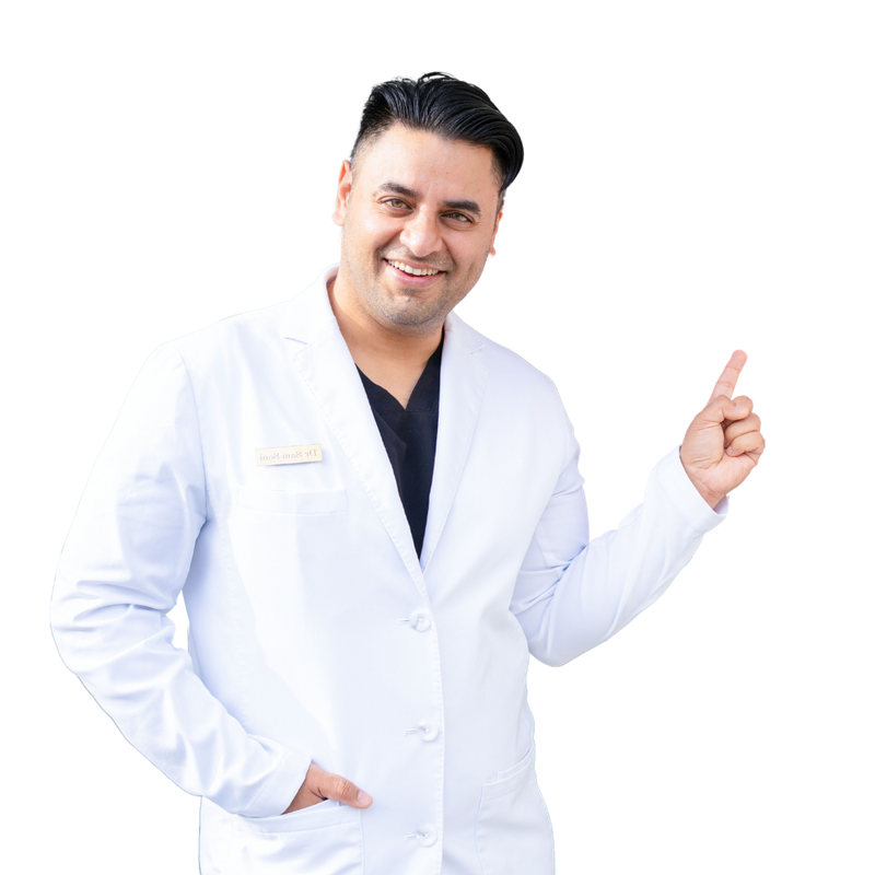 A man with a beard is smiling and giving a thumbs up