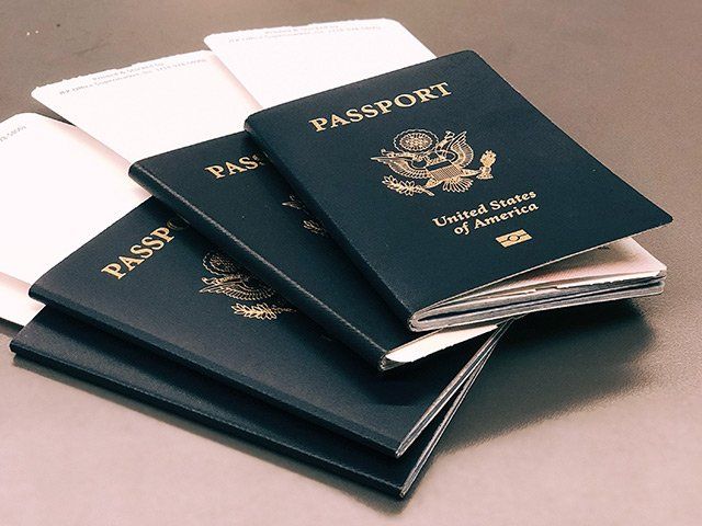 Four US passports on top of each other