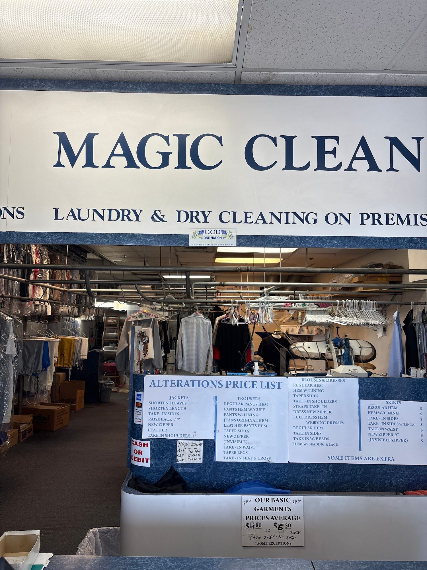 The inside of a moving truck filled with boxes and blankets.