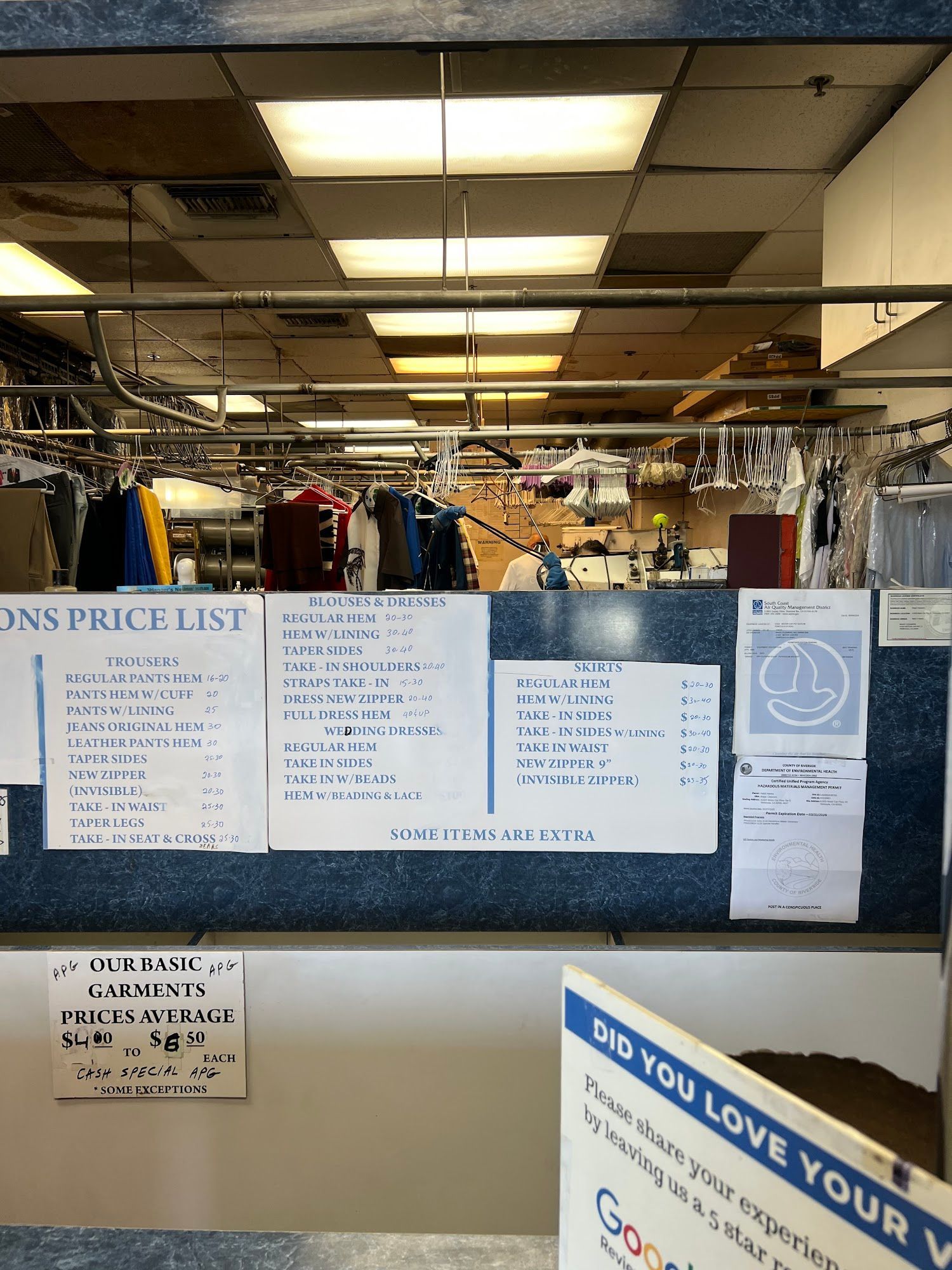 A white truck is parked in a parking lot next to a building.