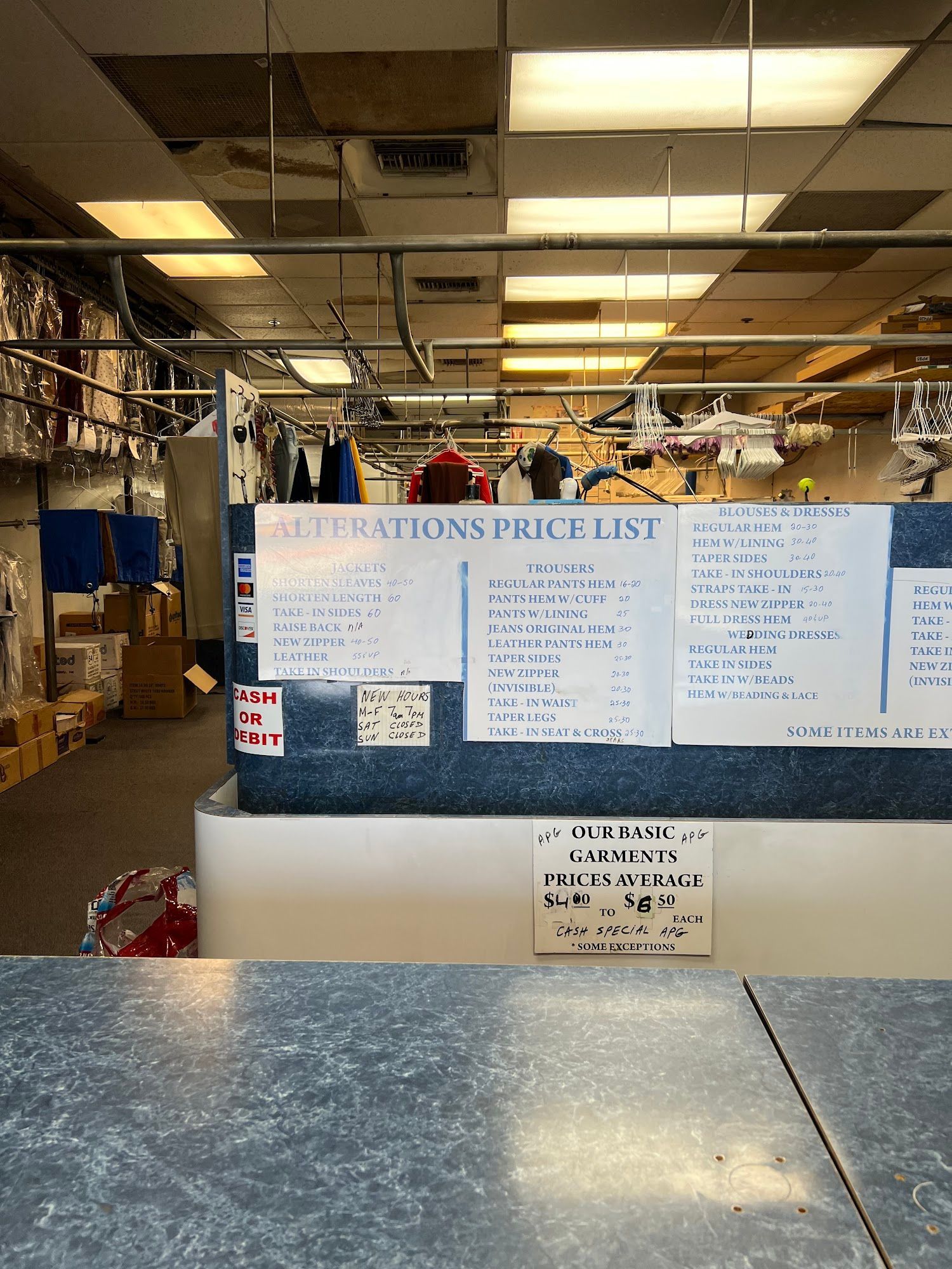 The inside of a moving truck filled with boxes and blankets.