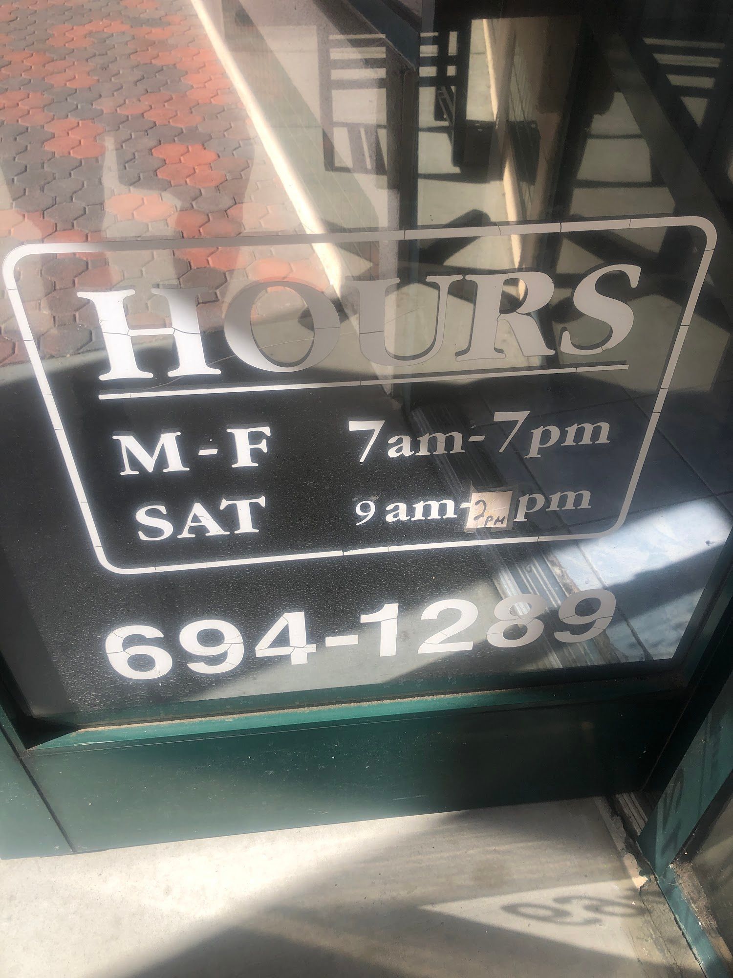 Hours sign on glass door: M-F 7am-7pm, Sat 9am-5pm. Phone number 694-1289.