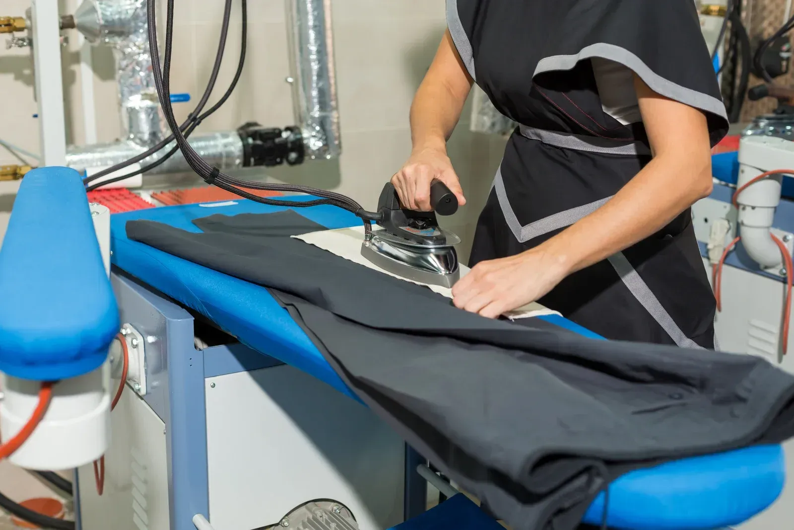 A white truck is parked in a parking lot next to a building.