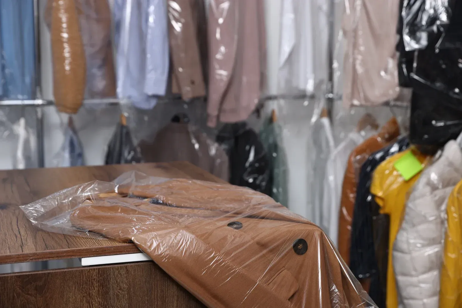 A white truck is parked in a parking lot next to a building.