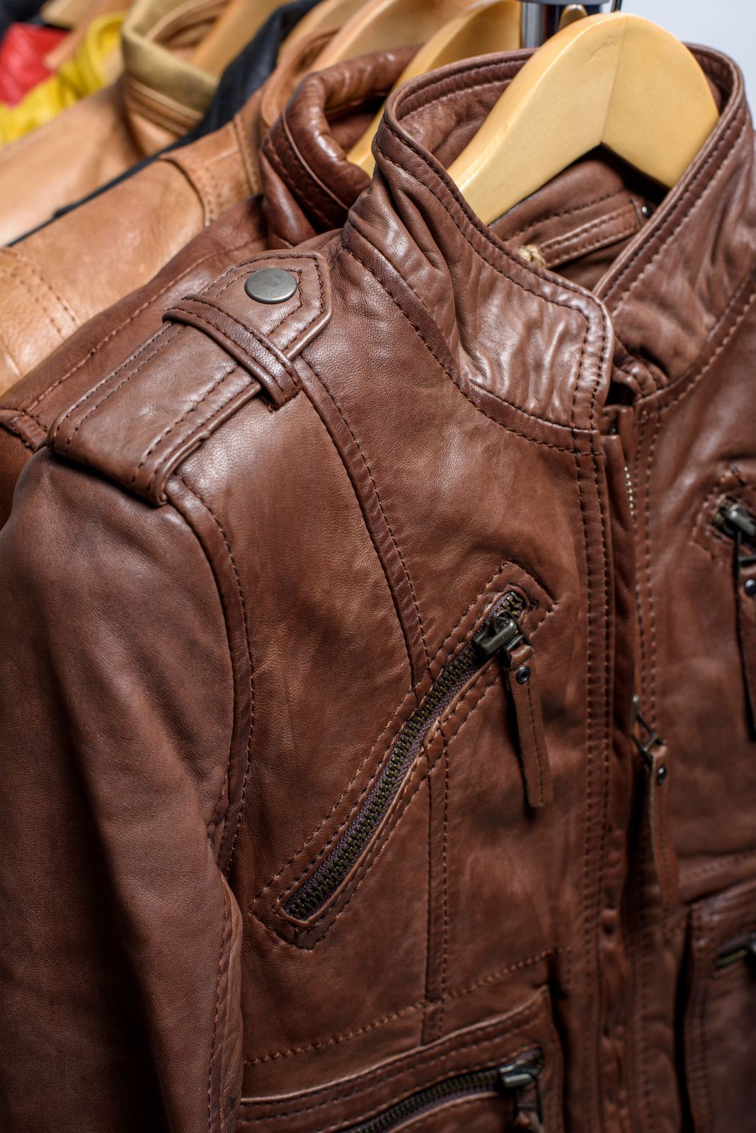 A white truck is parked in a parking lot next to a building.