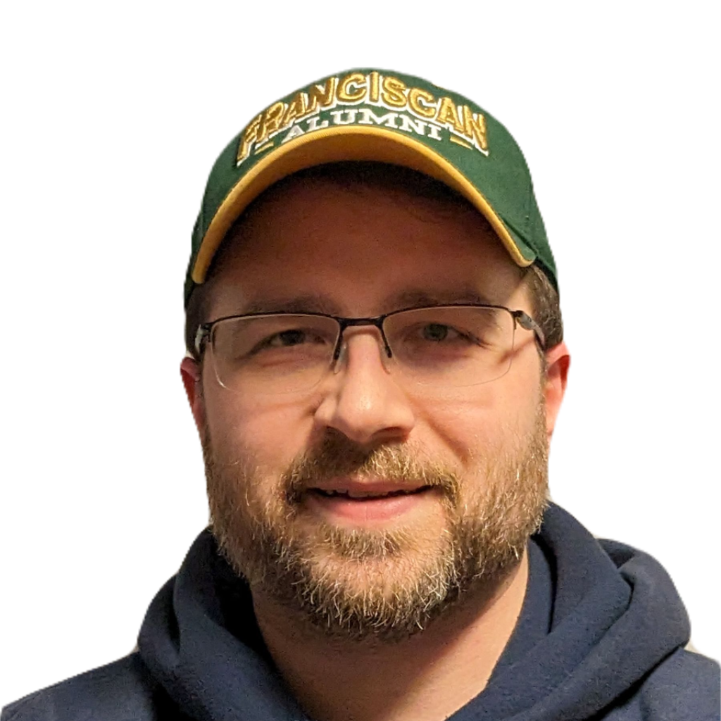 A man with a beard wearing a green hat that says alumni