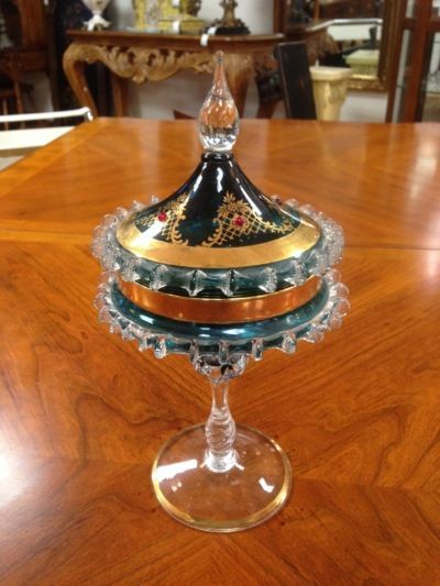 A glass container with a lid is sitting on a wooden table