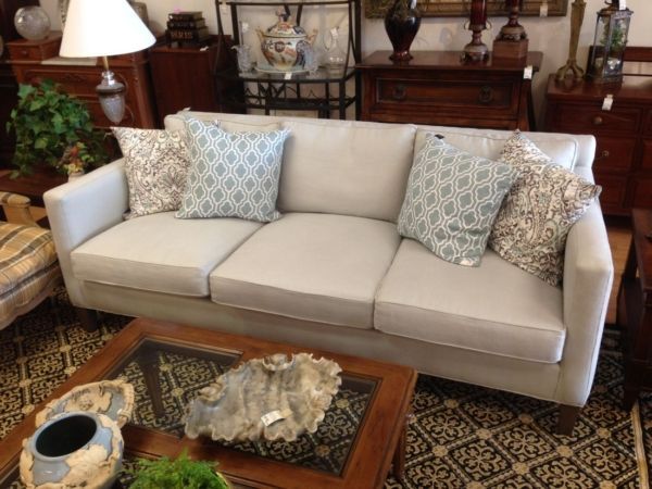 A living room with a couch and a coffee table