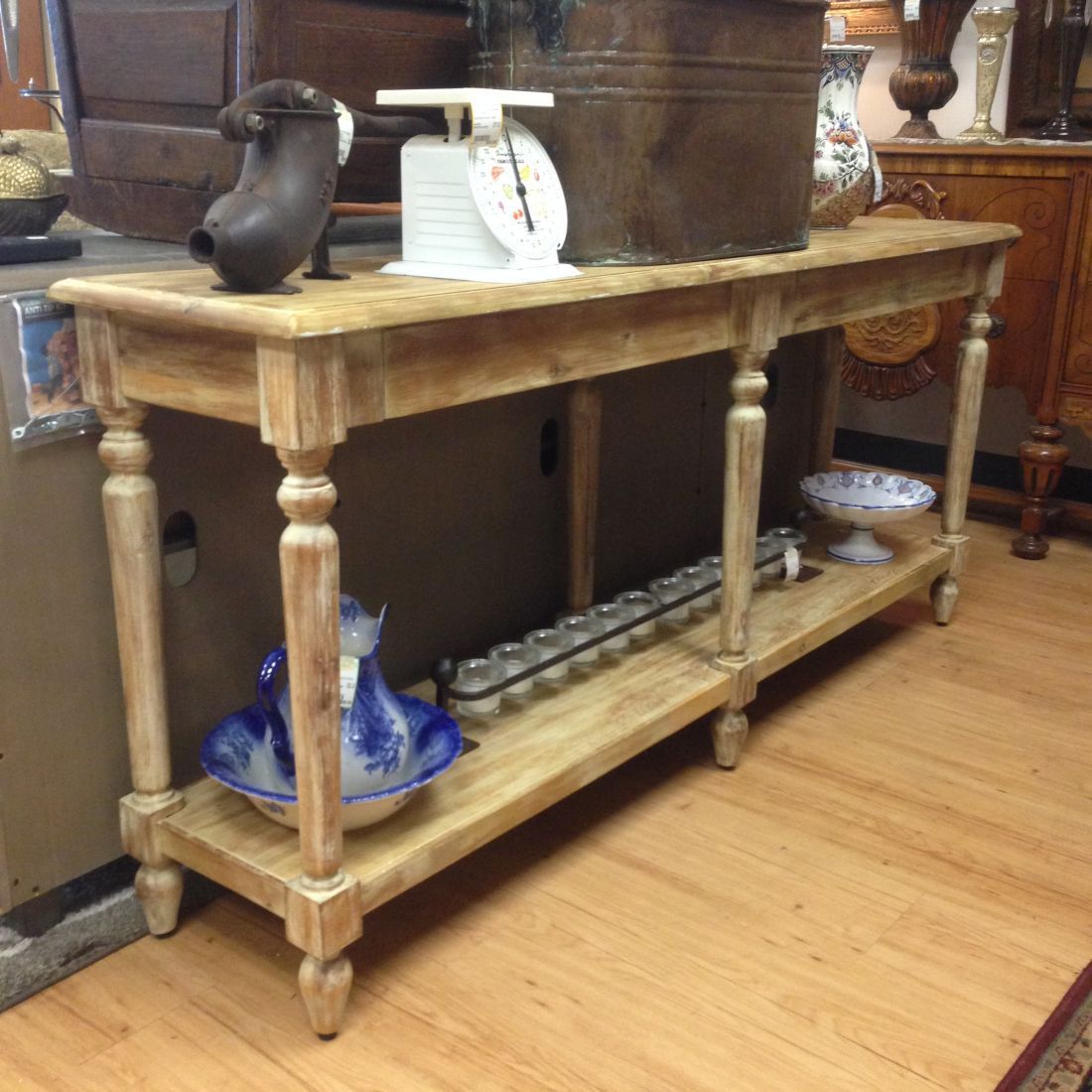 A wooden table with a scale on top of it