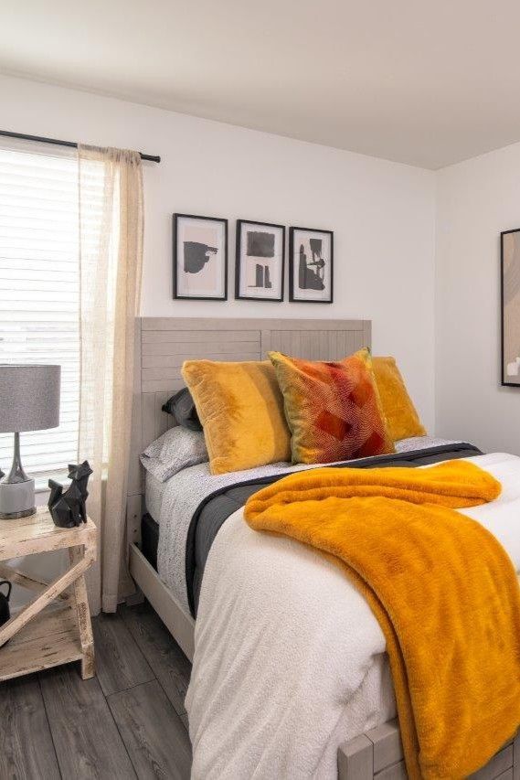 A large room with tables , chairs , a fireplace and a television.