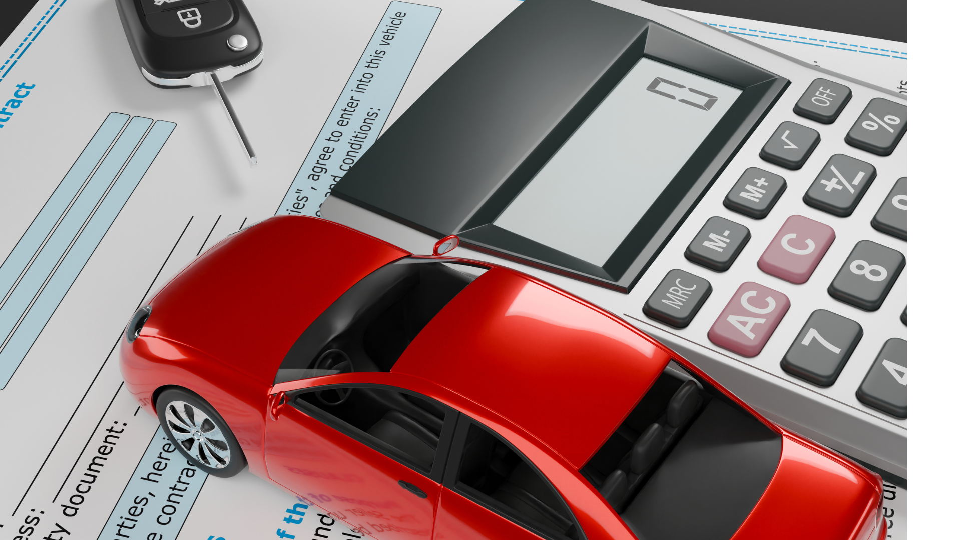 A red car is sitting next to a calculator and a key