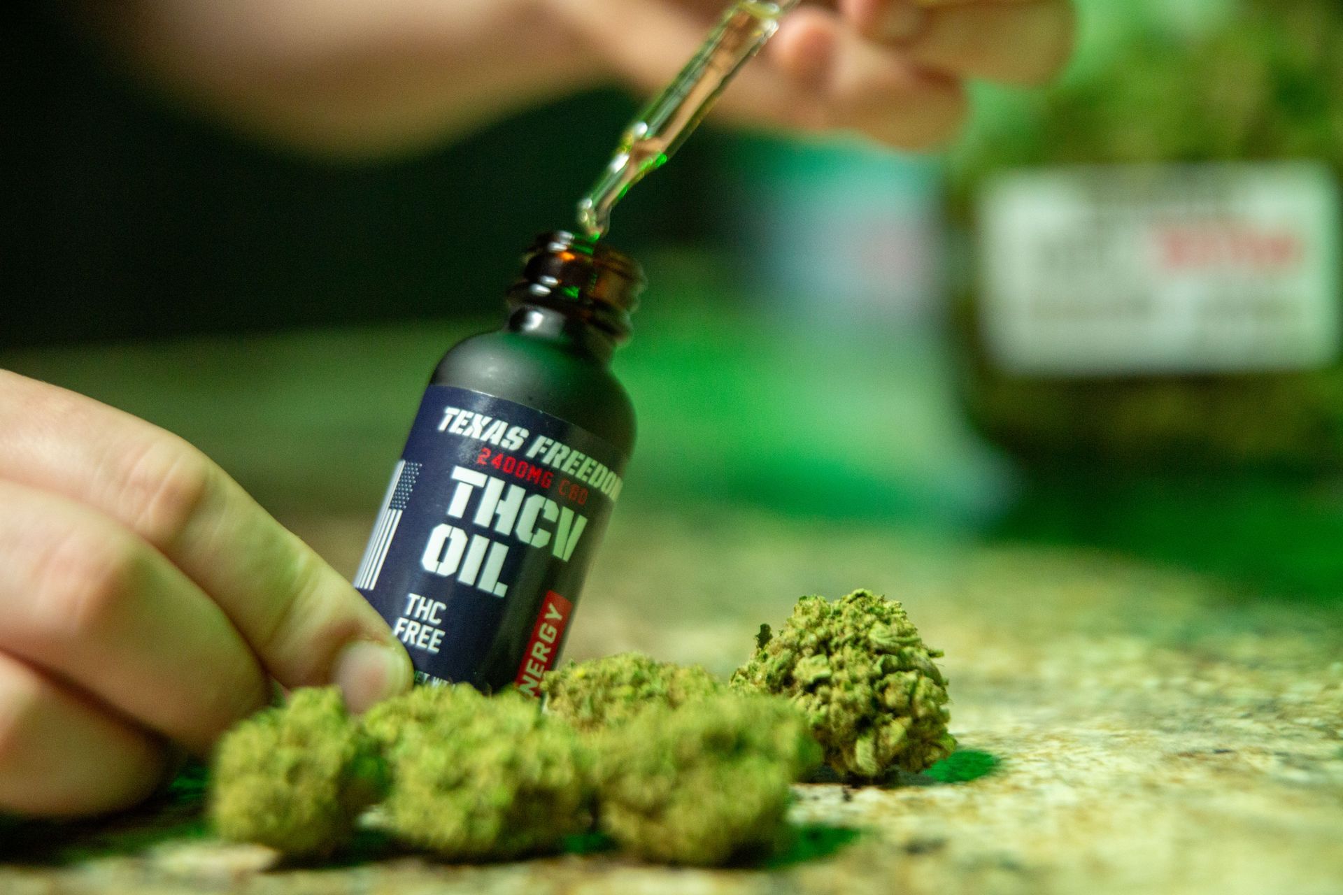 Getting some oil out of a bottle of THCv Oil from Texas Freedom CBD