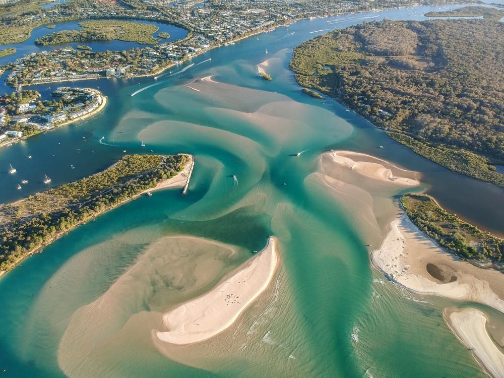 An Aerial View of a Large Body of Water Surrounded by Islands — O'Brien Painting Contractors in Noosa, QLD