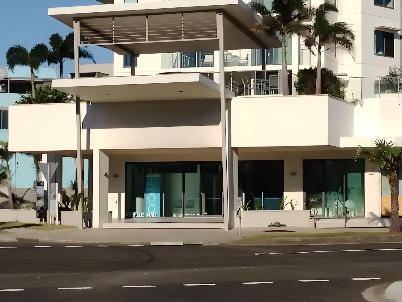 A Large White Building With a Lot of Windows and Balconies — O'Brien Painting Contractors in Alexandra Headland, QLD