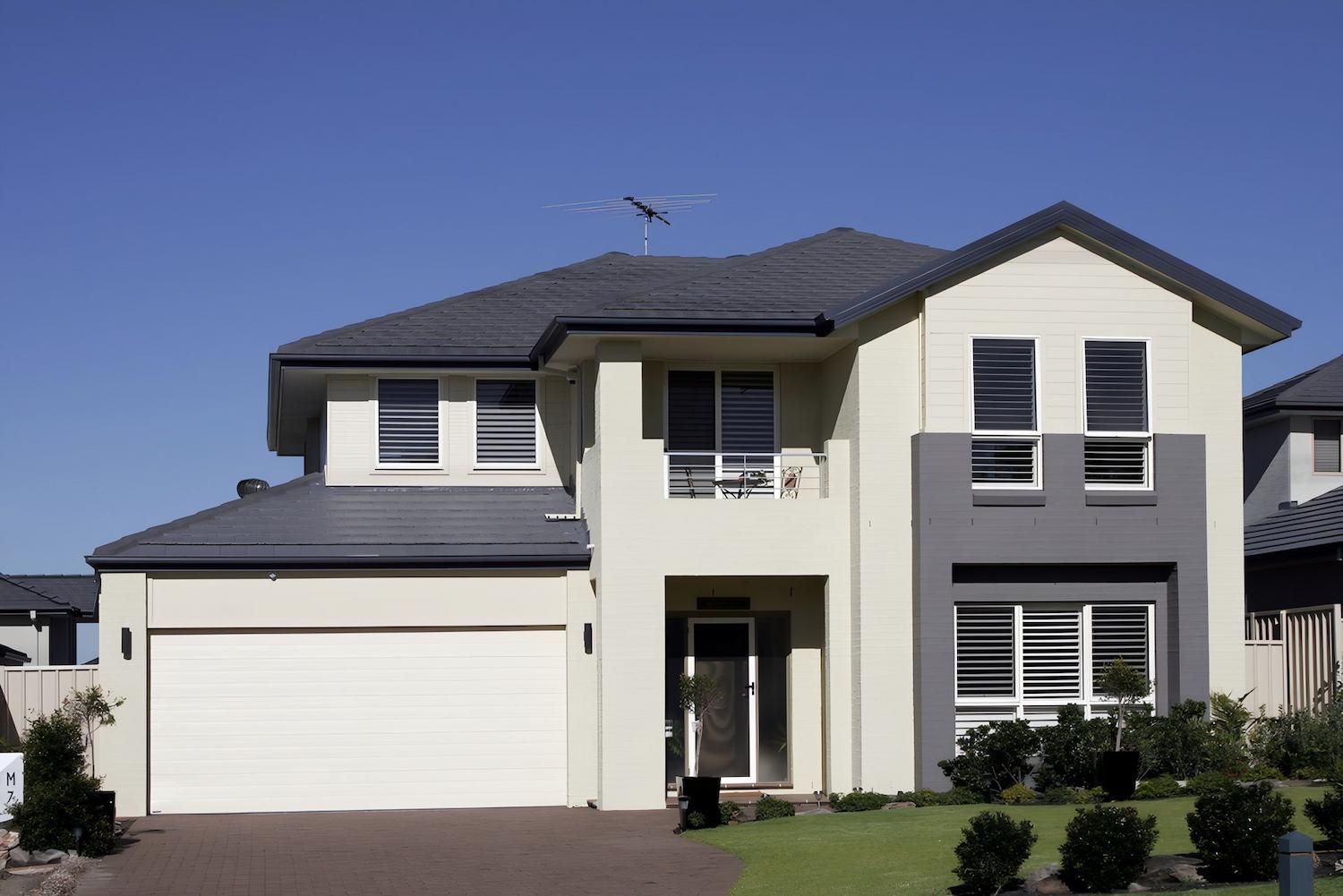 A Large White House With a Gray Roof — O'Brien Painting Contractors in Nambour, QLD 