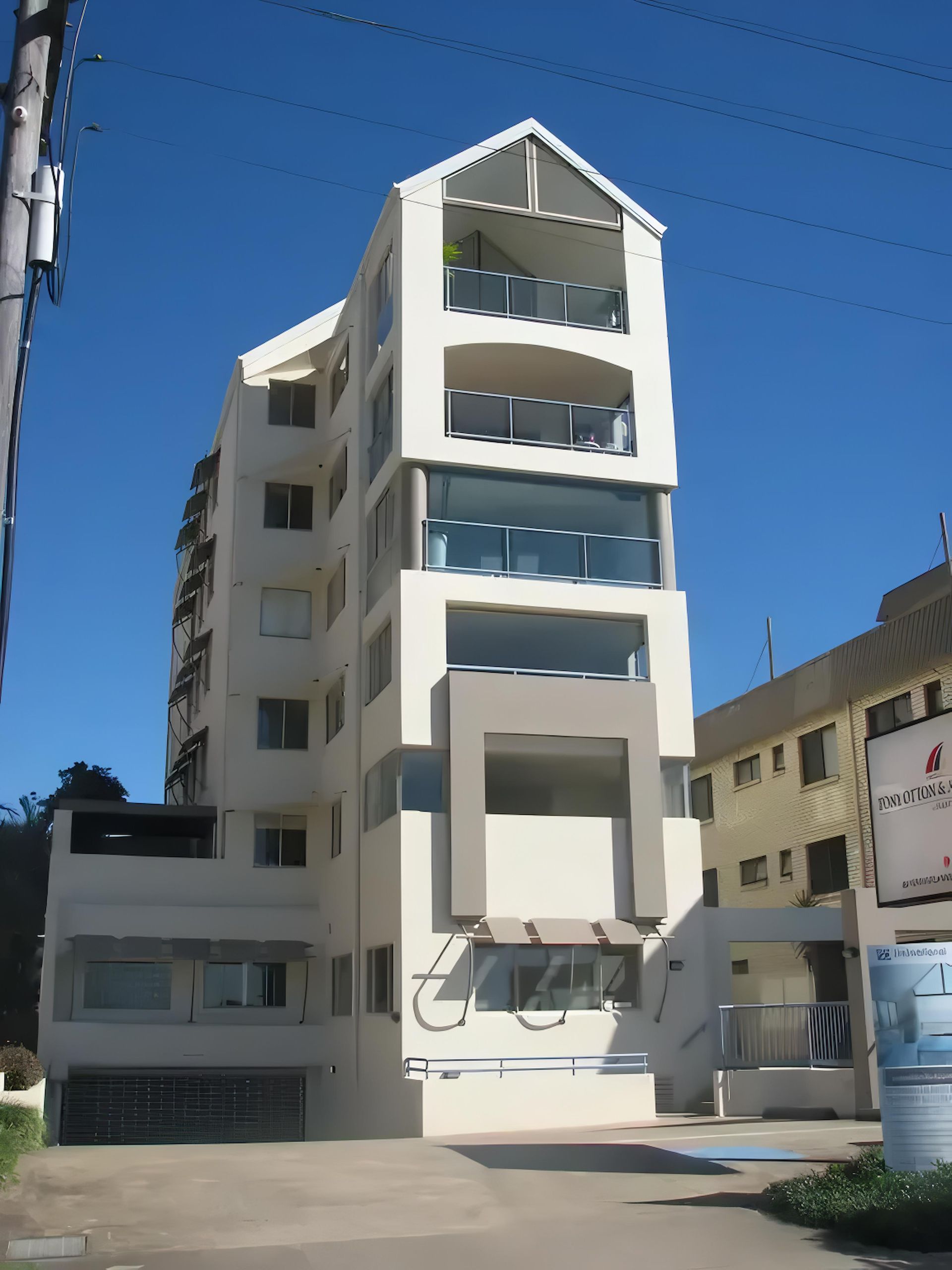 A Tall White New Repaint Building — O'Brien Painting Contractors in Noosa, QLD