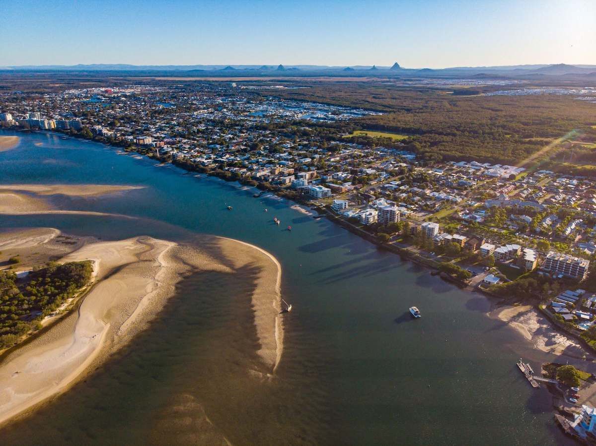 An Aerial View of a River With a City in the Background — O'Brien Painting Contractors in Caloundra, QLD
