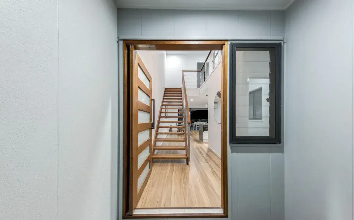 A View of a Staircase Through a Doorway in a House — O'Brien Painting Contractors in Alexandra Headland, QLD