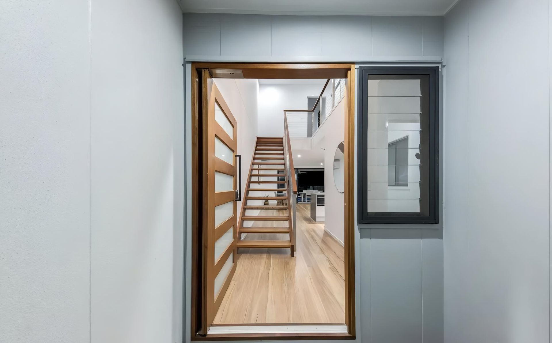 A Doorway Leading to a Staircase in a House — O'Brien Painting Contractors in Noosa, QLD
