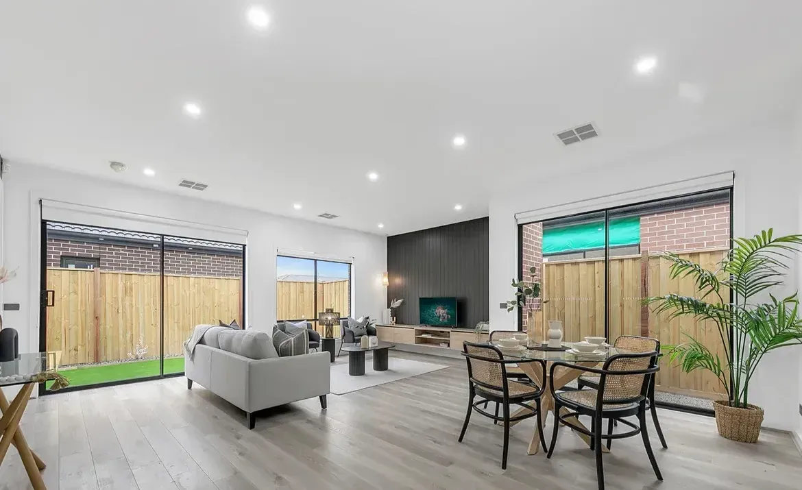 A Living Room and Dining Room in a House With Sliding Glass Doors — O'Brien Painting Contractors in Alexandra Headland, QLD