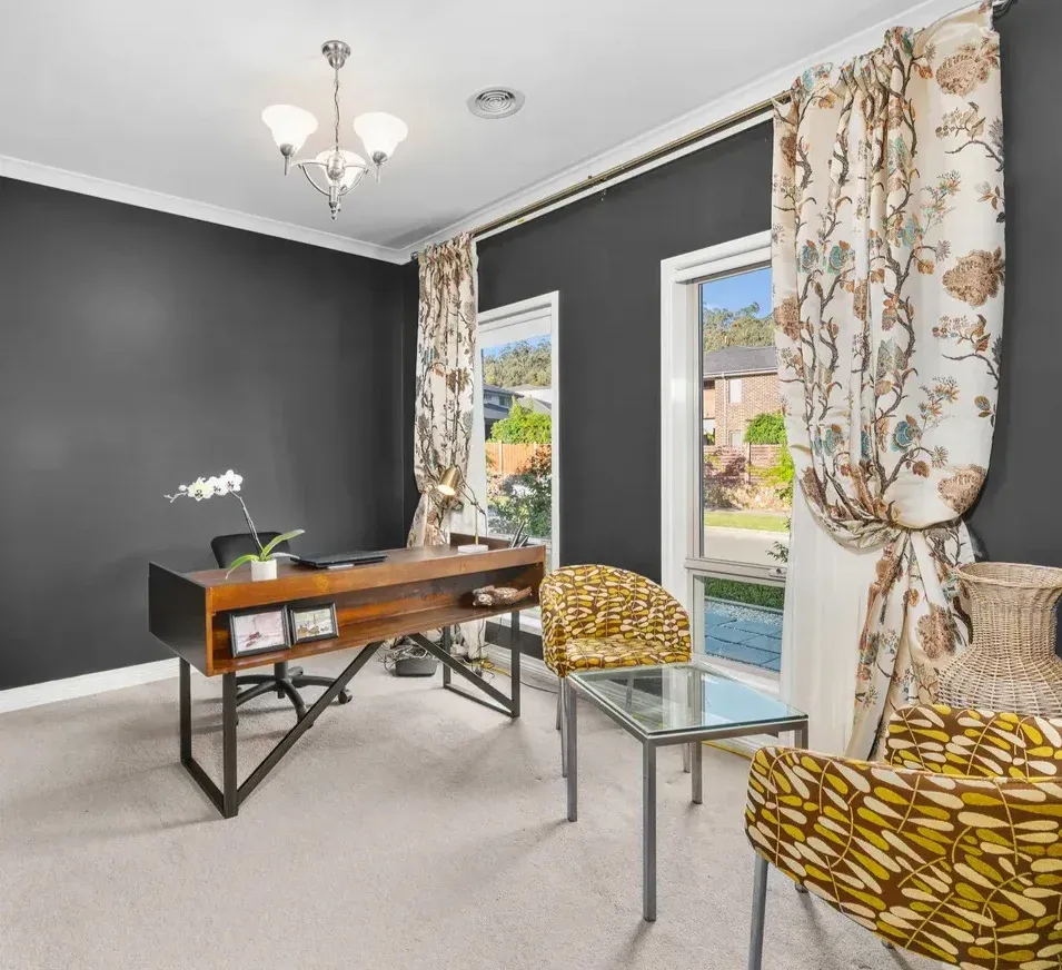 A Living Room With a Desk, Chairs and a Table — O'Brien Painting Contractors in Alexandra Headland, QLD