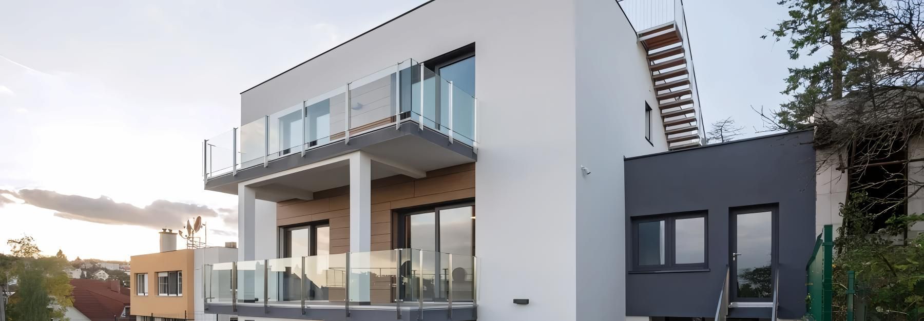Two Men Are Painting a Blue Wall in a Room — O'Brien Painting Contractors in Alexandra Headland, QLD