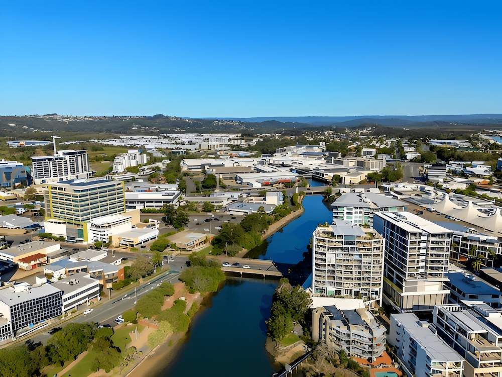 An Aerial View of a City With a River Running Through It — O'Brien Painting Contractors in Maroochydore, QLD