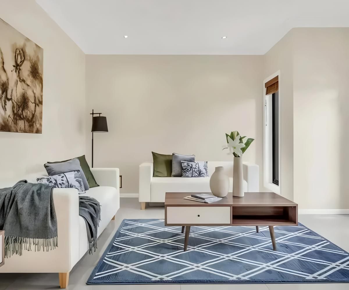A Living Room With a Couch, Coffee Table, and Rug — O'Brien Painting Contractors in Maroochydore, QLD