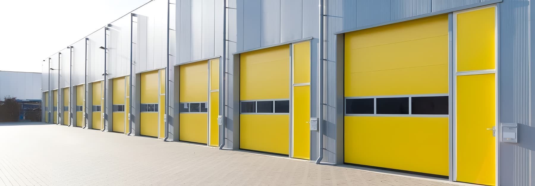 A Row of Yellow Garage Doors — O'Brien Painting Contractors in Alexandra Headland, QLD