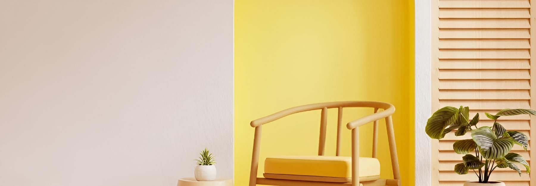 A Living Room With Yellow Walls and a Wooden Chair — O'Brien Painting Contractors in Alexandra Headland, QLD