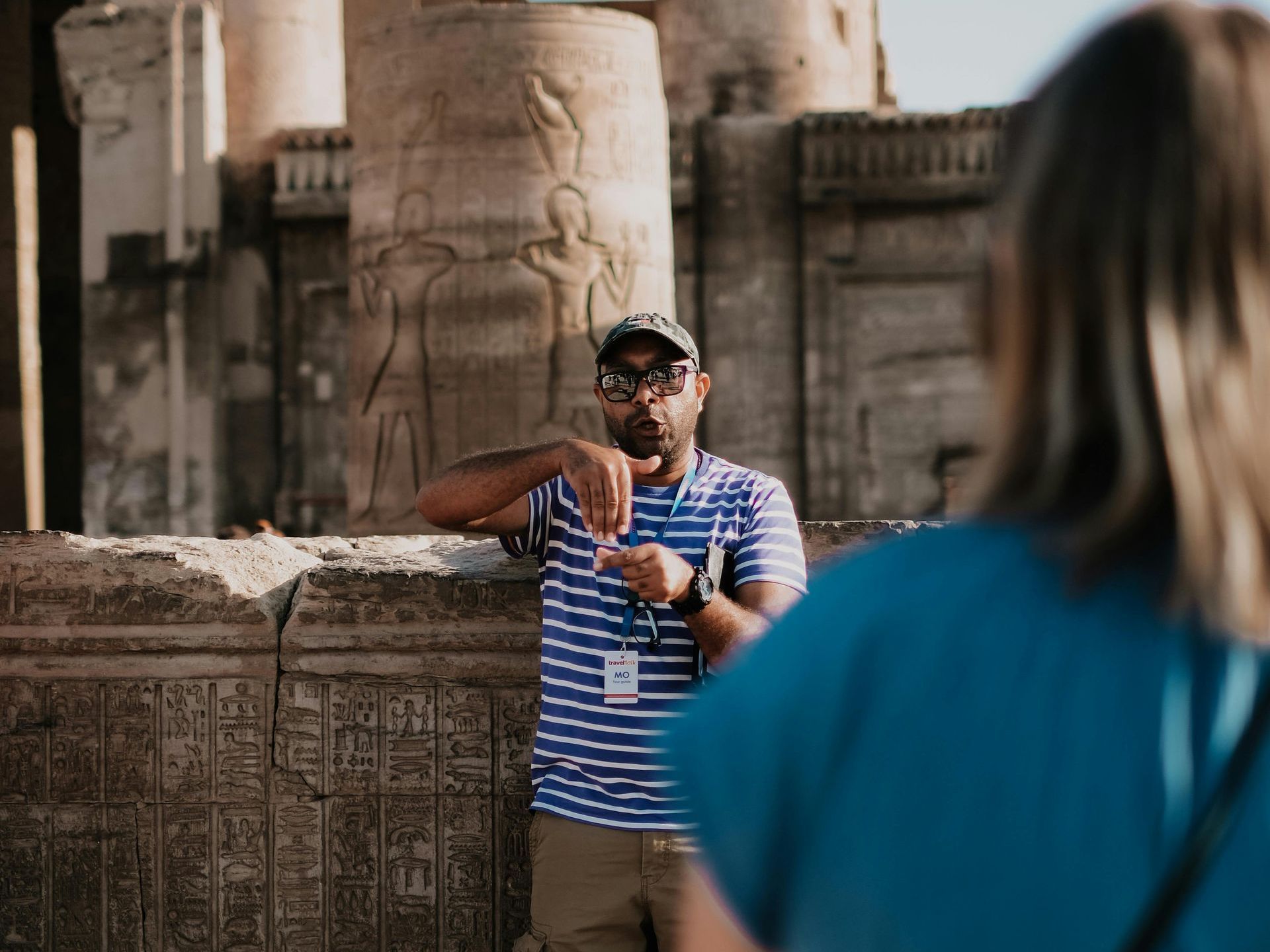 Tour Guide in Egypt: Experienced guide leading tourists through Egypt’s historical sites with cultural insights.