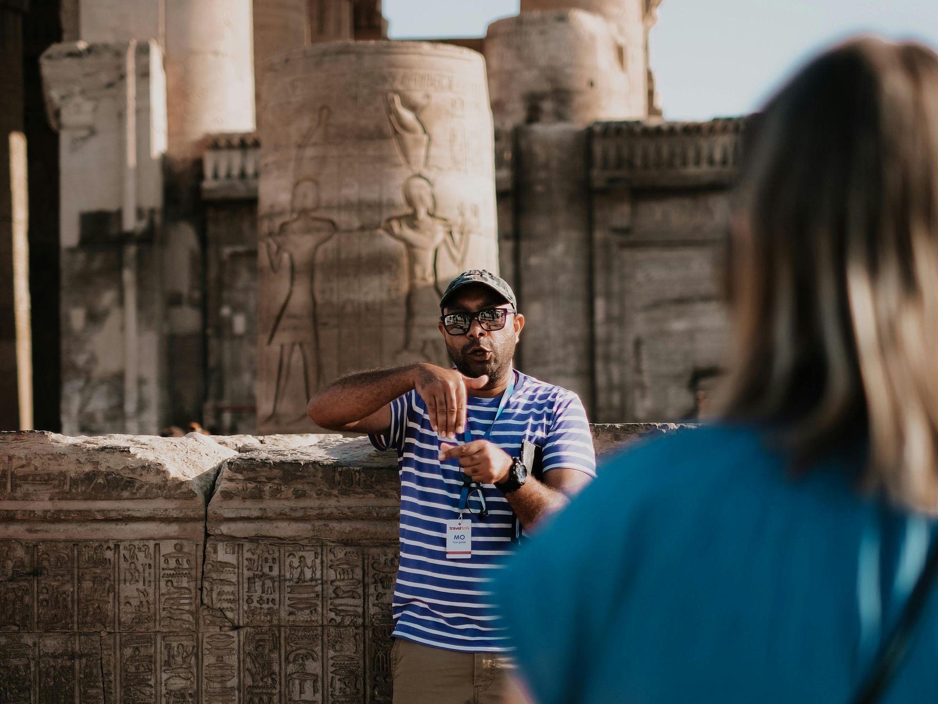 Tour Guide in Egypt: Experienced guide leading tourists through Egypt’s historical sites with cultural insights.