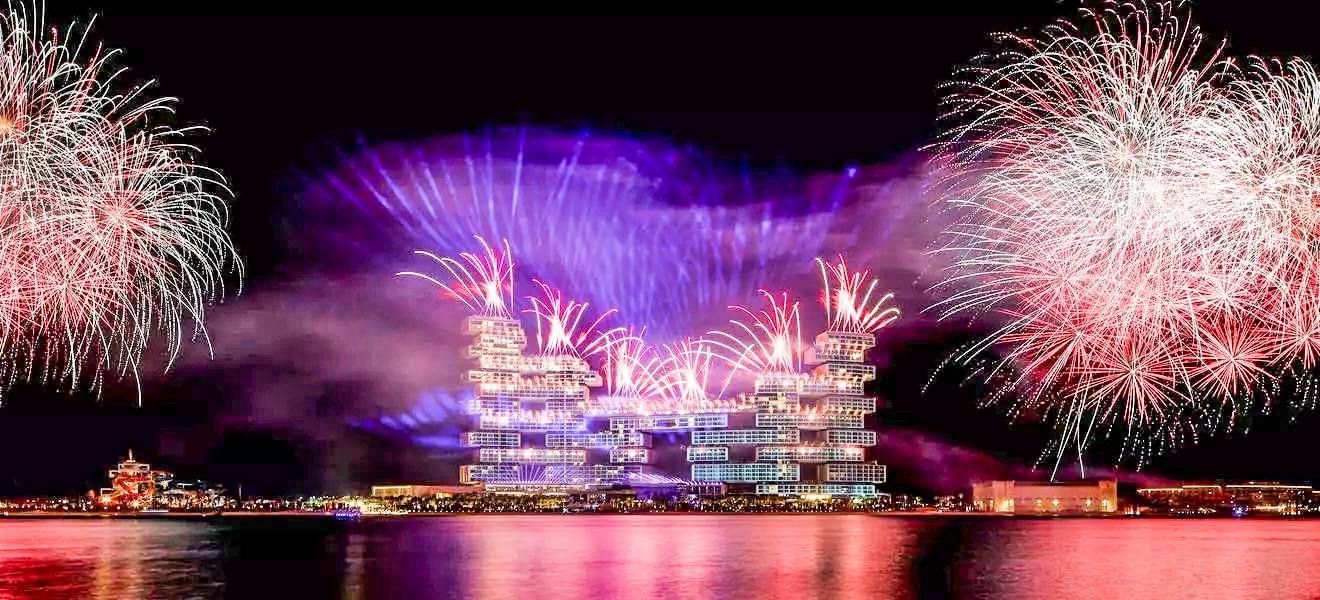 Atlantis the Royal.  Fireworks of Pink and Purple on an iconic hotel building for its launch.