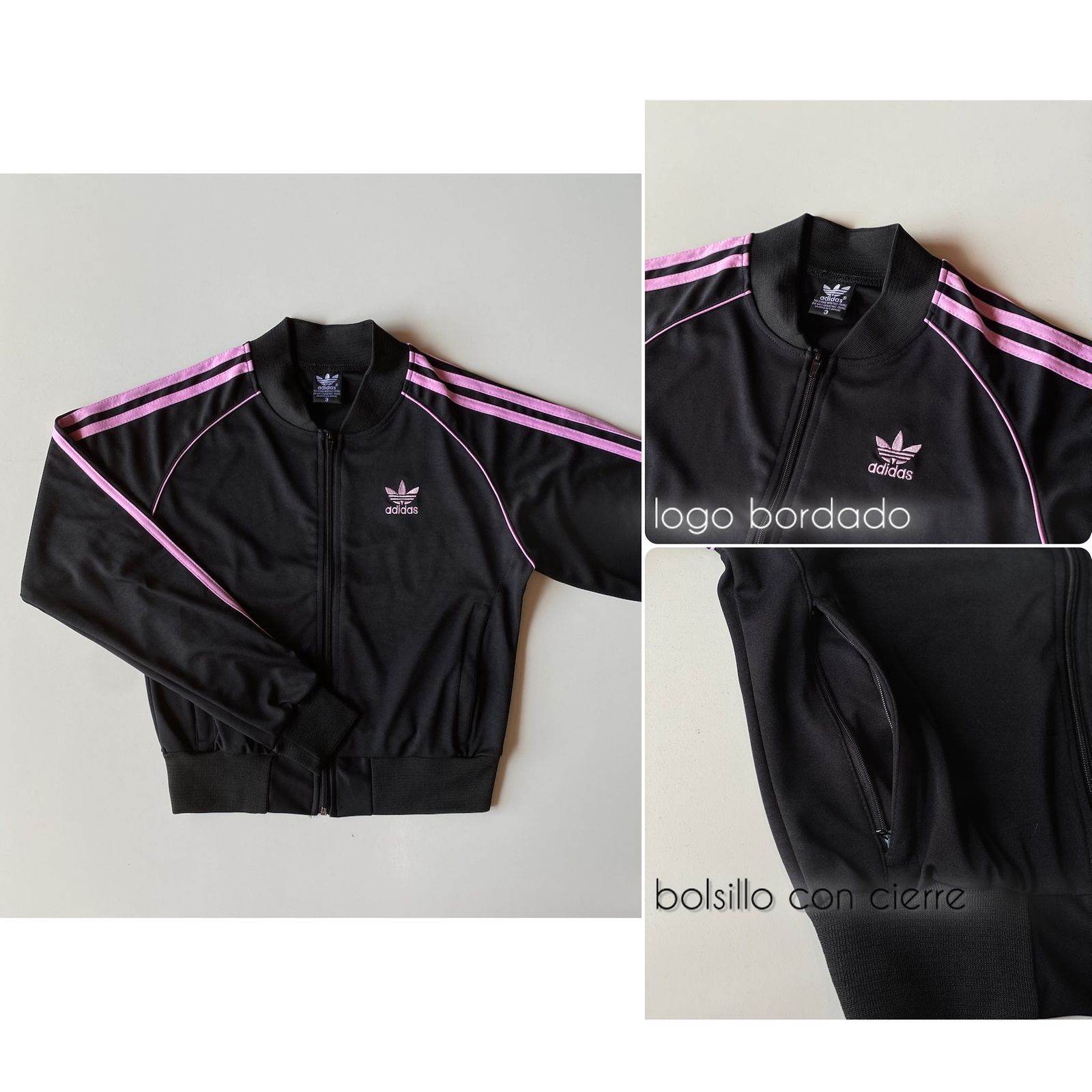 Chaqueta deportiva negra de Adidas con rayas rosas, logotipo bordado y bolsillos con cremallera.