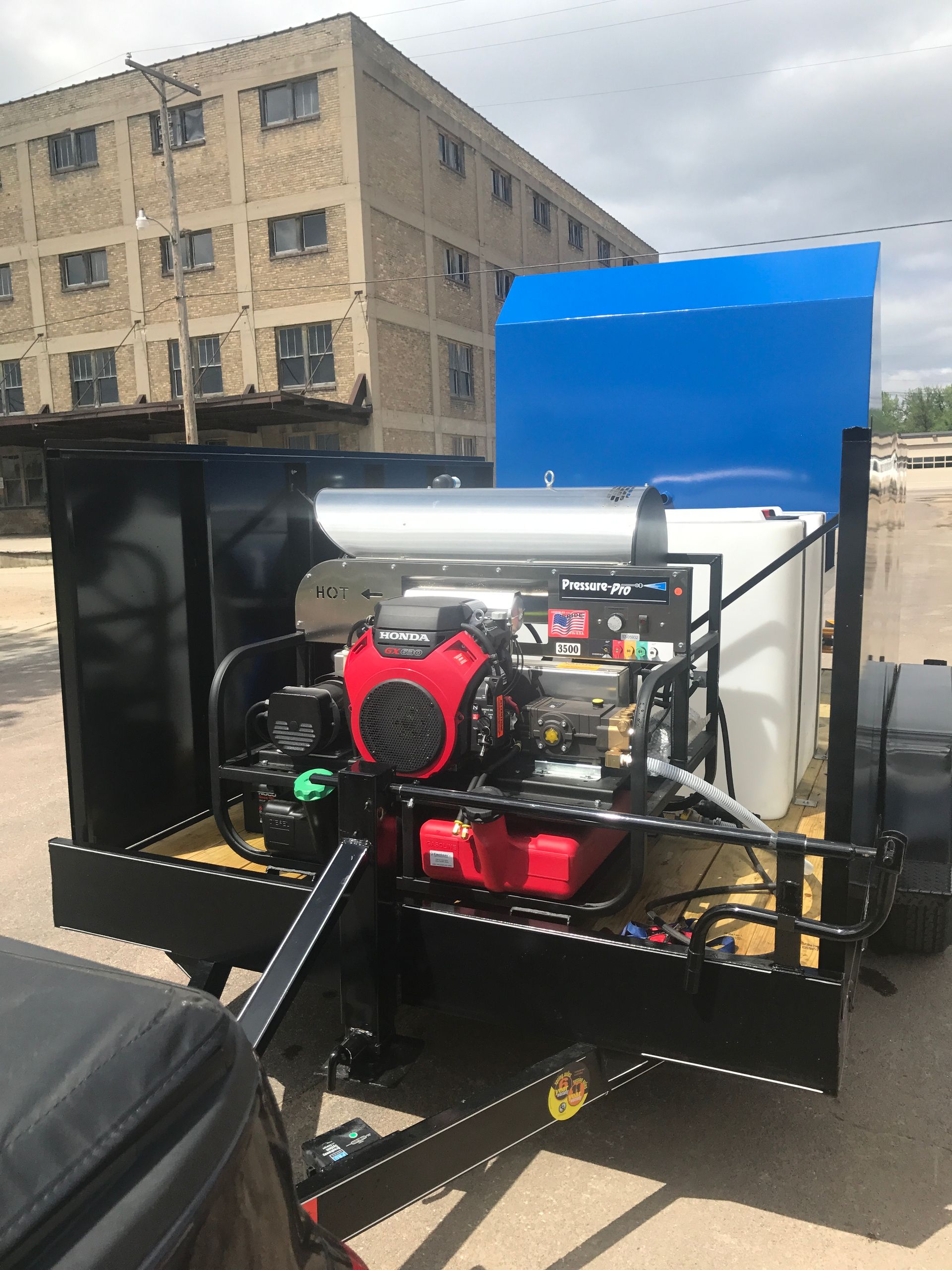 pressure washing equipment on bin cleaning trailer