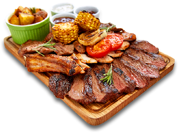 A wooden cutting board topped with a variety of meats and vegetables.