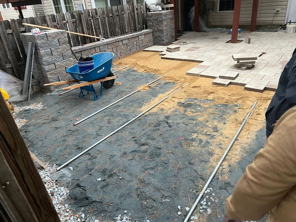 A ladder is sitting in front of a house under construction.