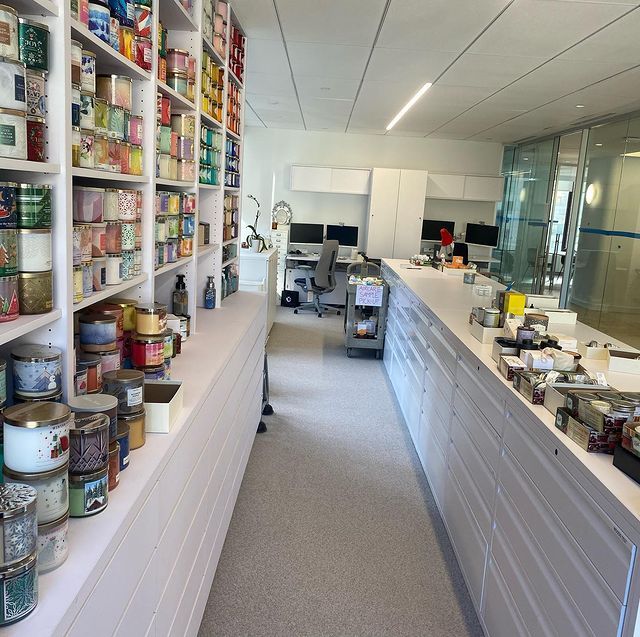 A long hallway with lots of cans on shelves