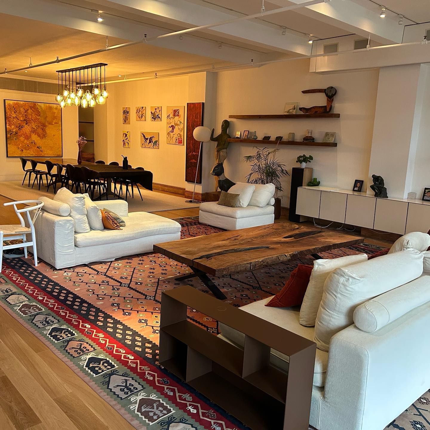 A living room filled with furniture and a rug
